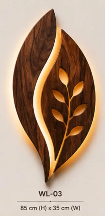 Carved wooden leaf wall lamp with a branch of cut-out leaves glowing with warm LED light