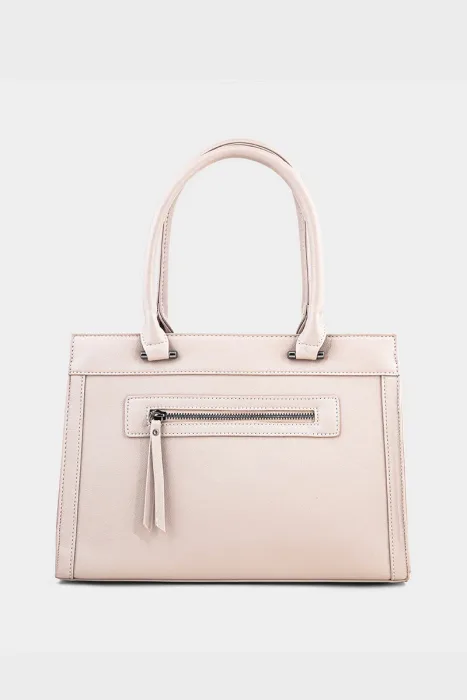 Front view of blush beige faux leather structured top handle tote bag with front zip pocket and tassel pull and silver hardware on white background