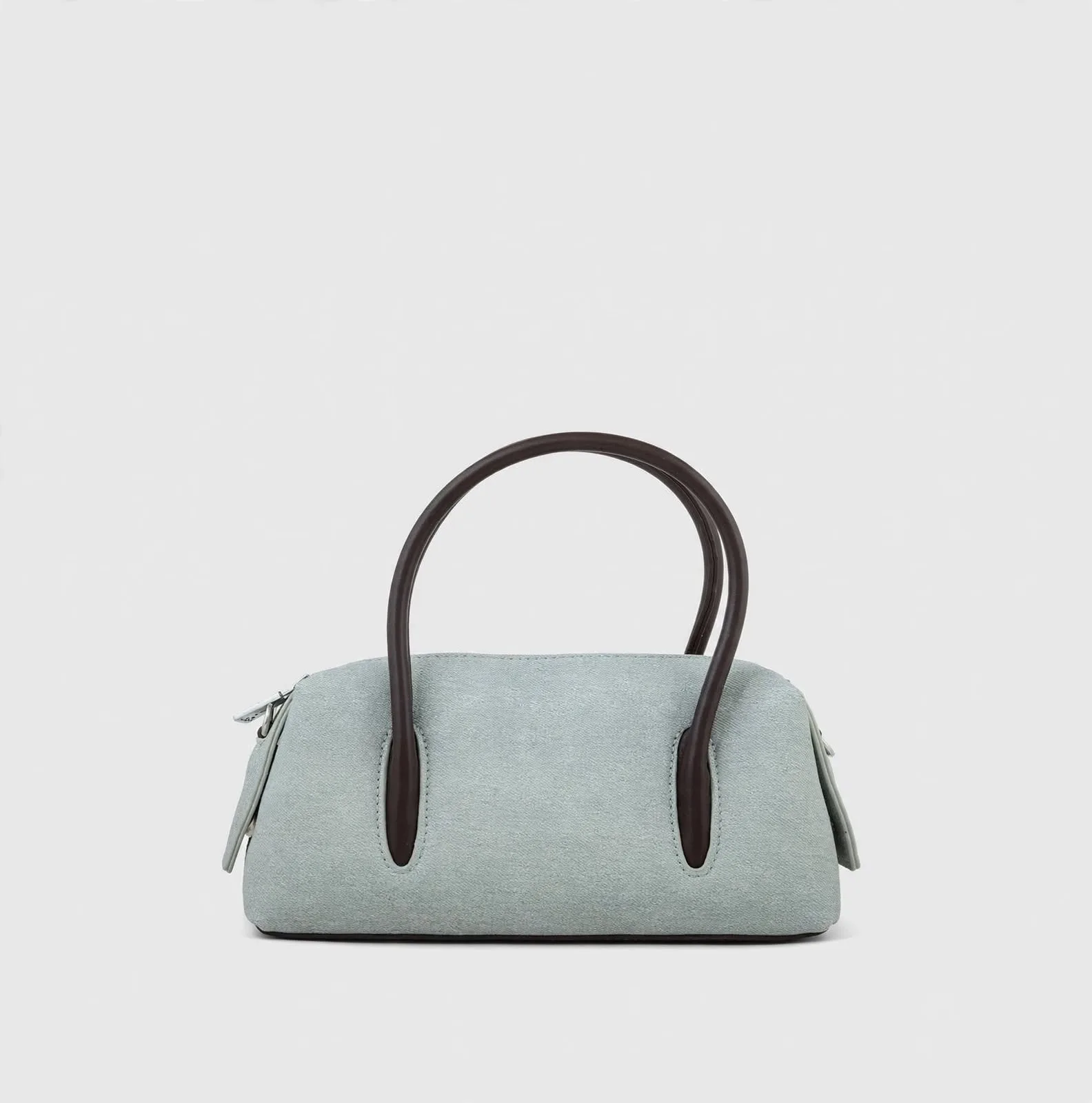 Sage green mini bowler bag with chocolate brown handles - front view